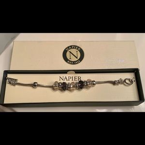 Bracelet, dark and light amethyst charms with silver accents on bracelet